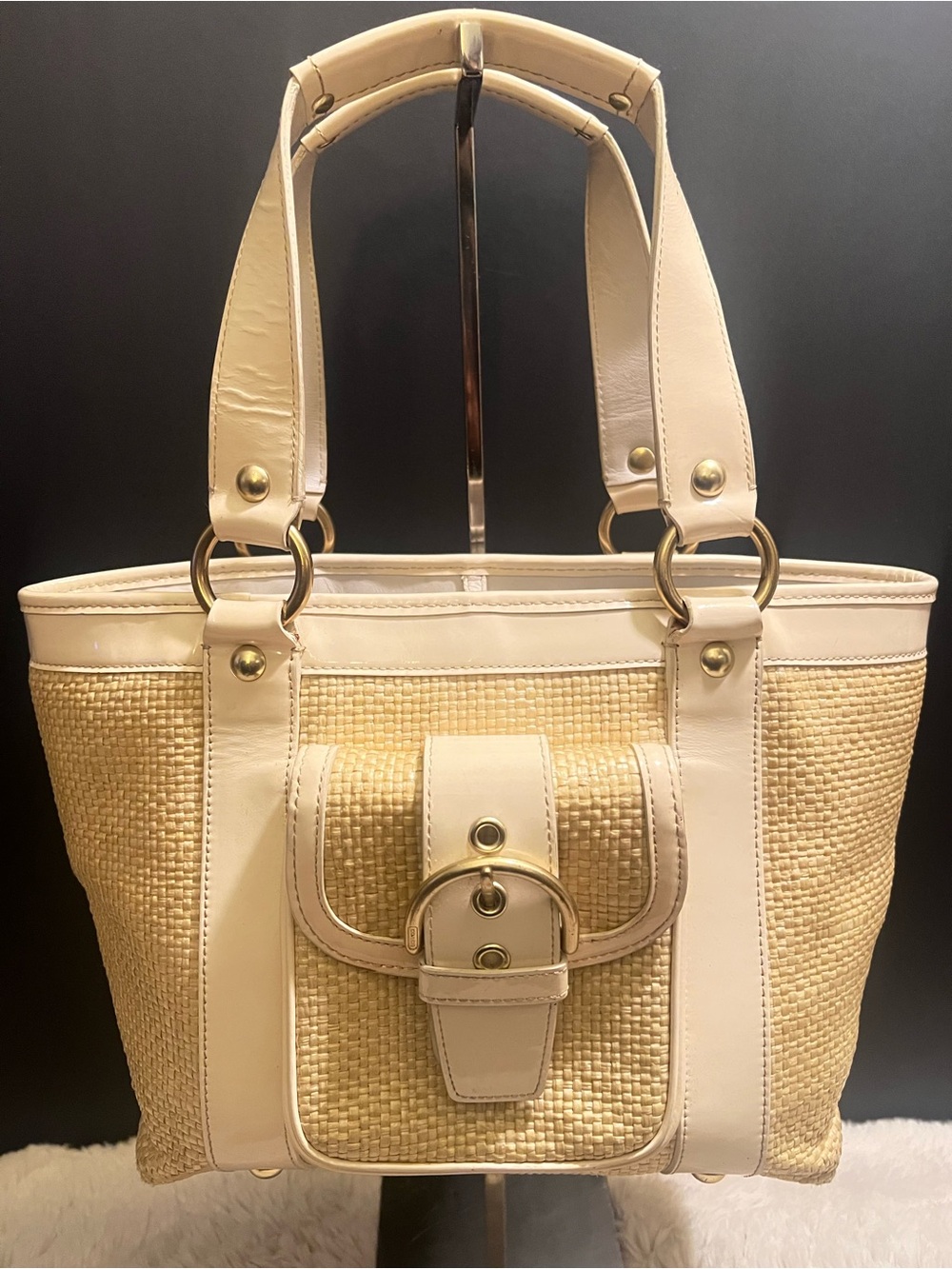 Coach white leather and straw tote.